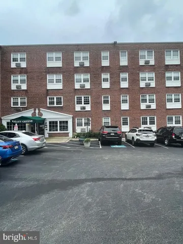 a view of a dresser with cabinets