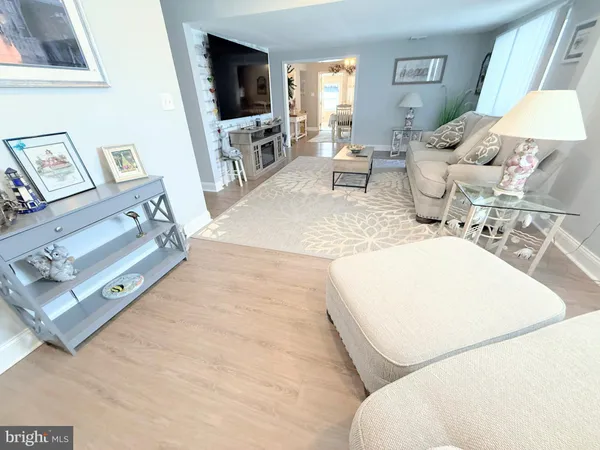 a bedroom with a bed and a potted plant