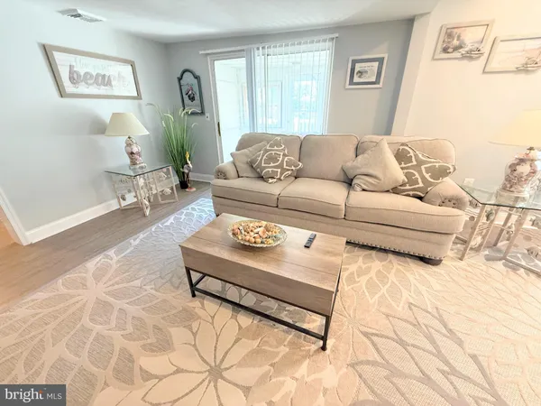 a dining room with furniture window wooden floor
