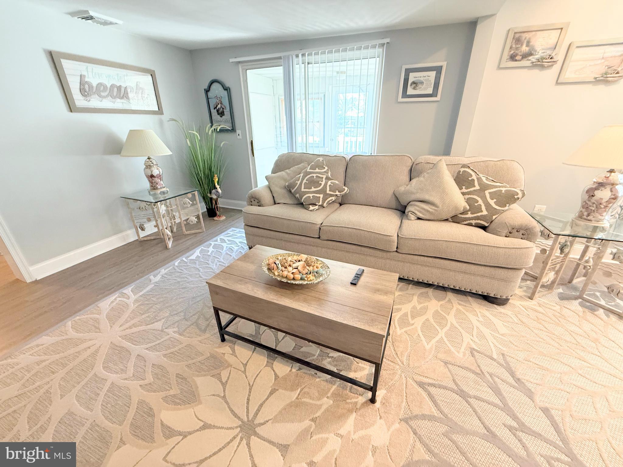 34479 Broad Water Road, Unit 644 Millsboro, DE 19966 - Photo 21 of 61 a living room with furniture and a couch