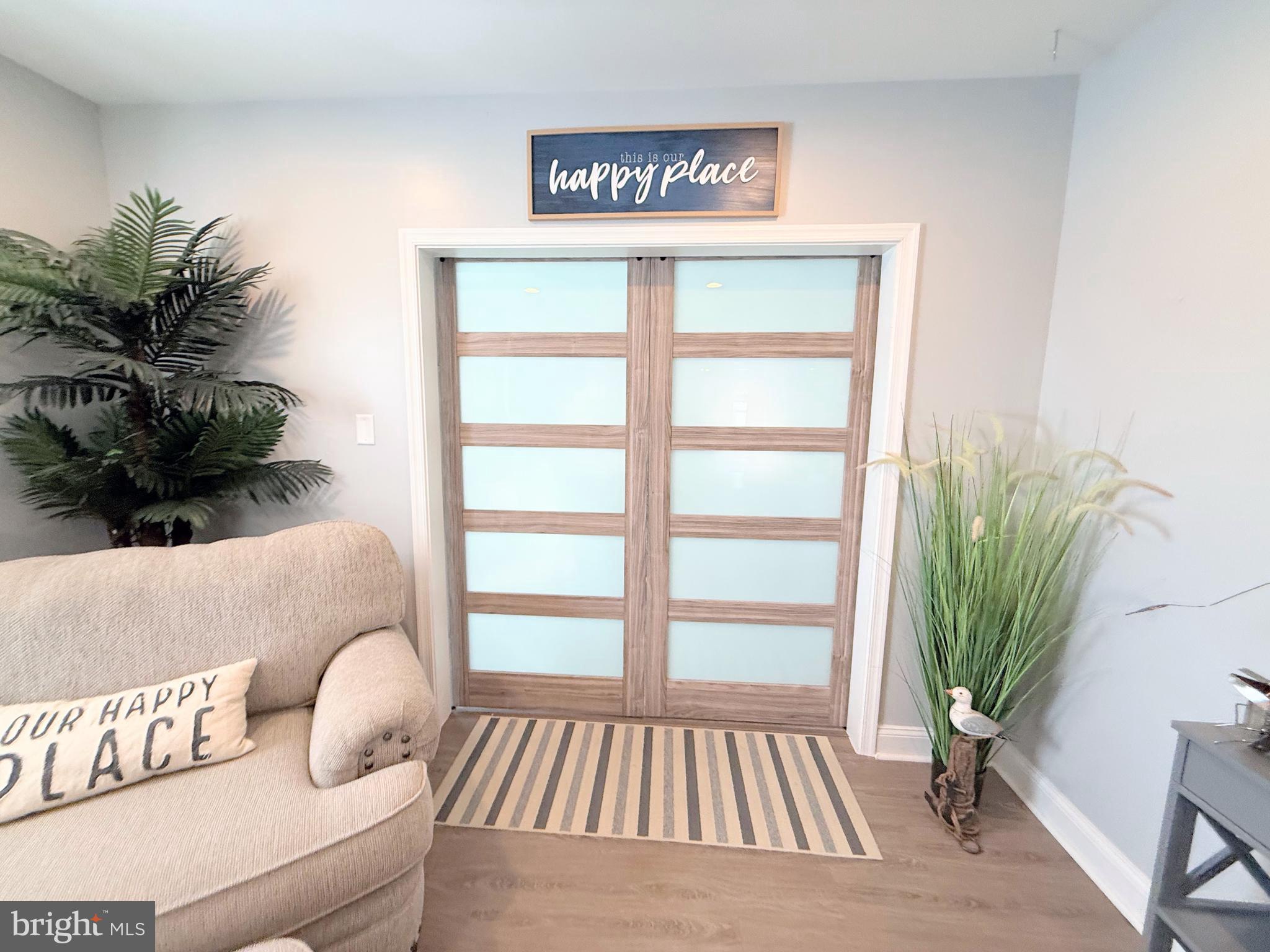 34479 Broad Water Road, Unit 644 Millsboro, DE 19966 - Photo 23 of 61 a bedroom with a bed and a potted plant