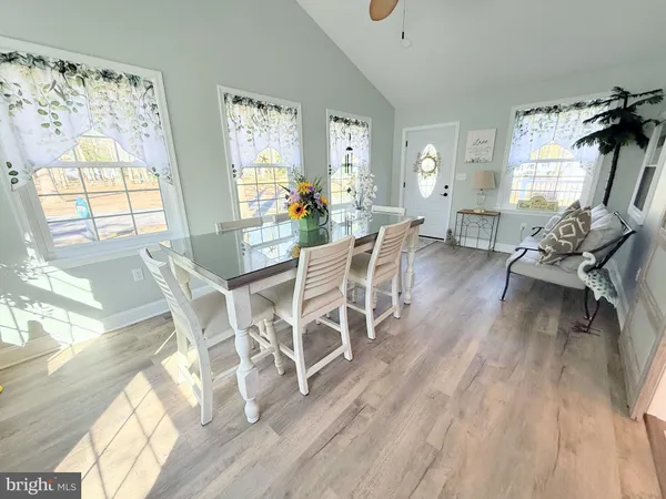 a dining room with furniture and window