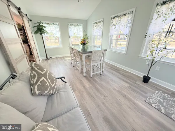 a kitchen with stainless steel appliances a stove a sink and a refrigerator