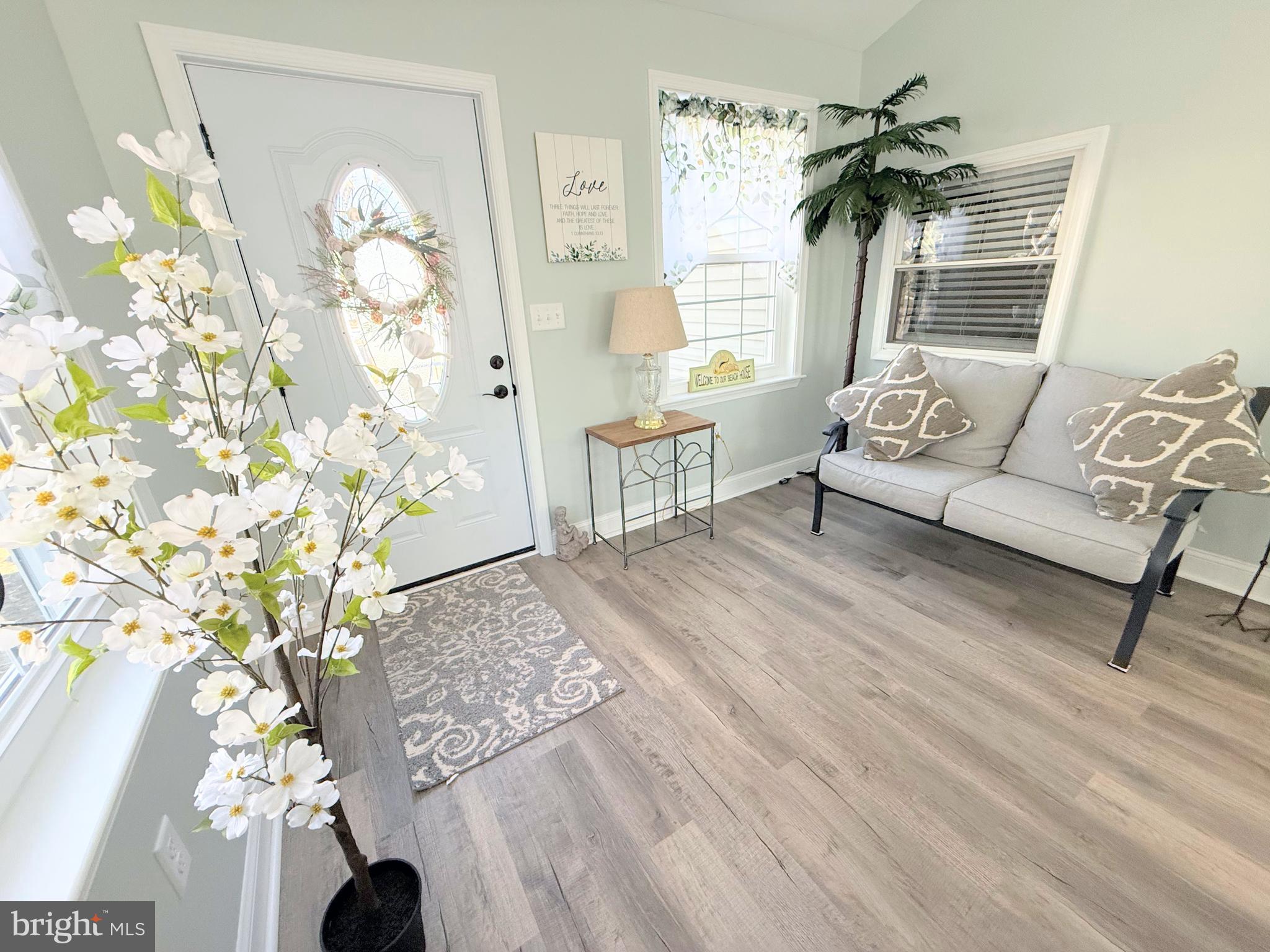 34479 Broad Water Road, Unit 644 Millsboro, DE 19966 - Photo 28 of 61 a living room with furniture and wooden floor