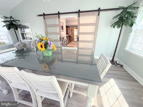 a kitchen with stainless steel appliances a stove microwave and sink