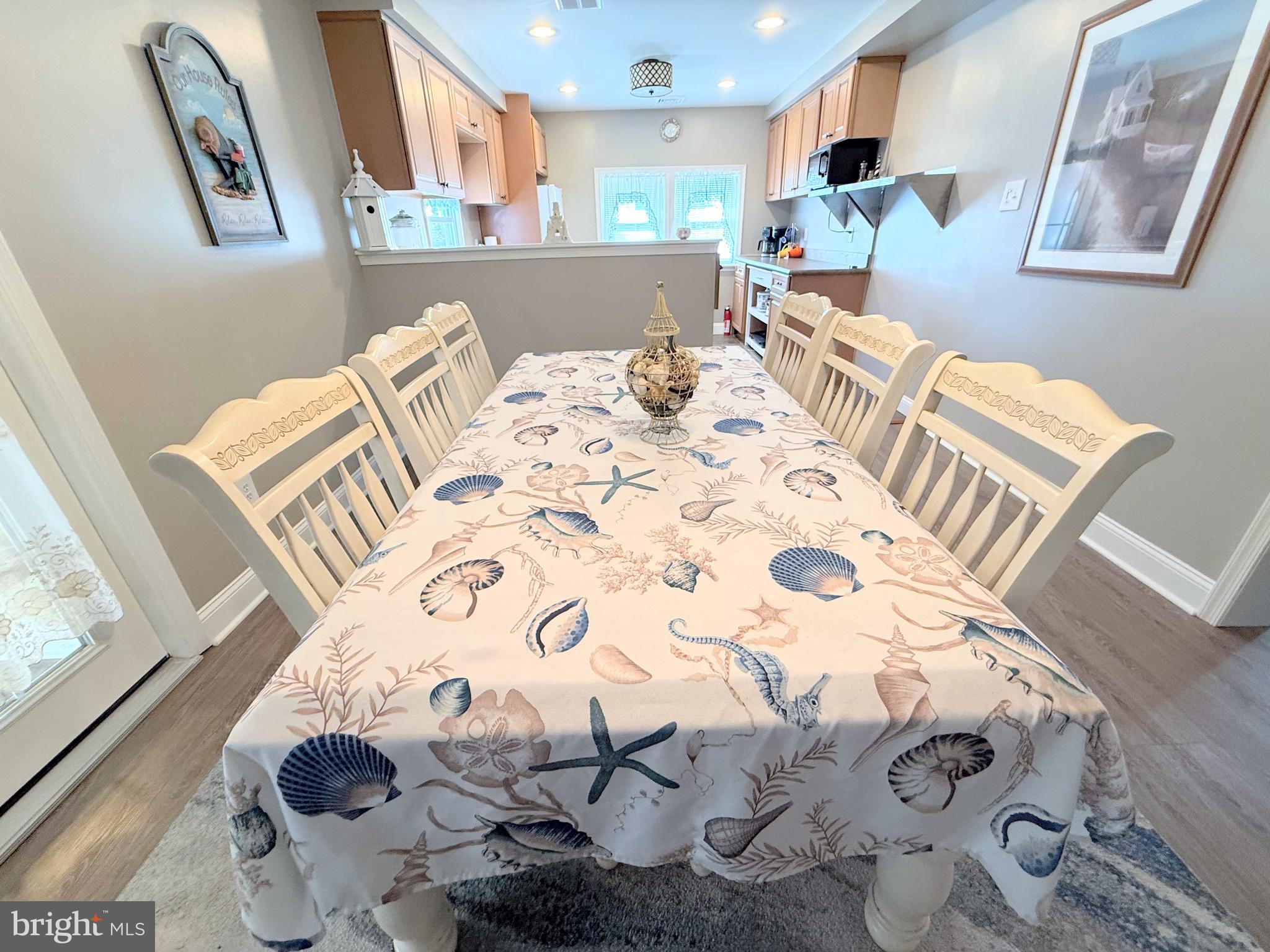 34479 Broad Water Road, Unit 644 Millsboro, DE 19966 - Photo 32 of 61 a bed sitting in a kitchen next to a window