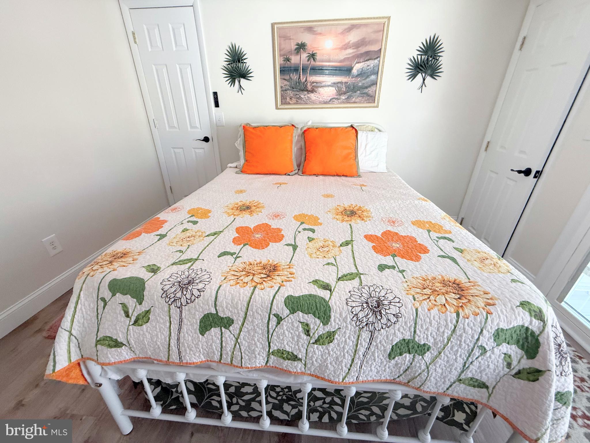 34479 Broad Water Road, Unit 644 Millsboro, DE 19966 - Photo 38 of 61 a bedroom with a bed and painting on the wall