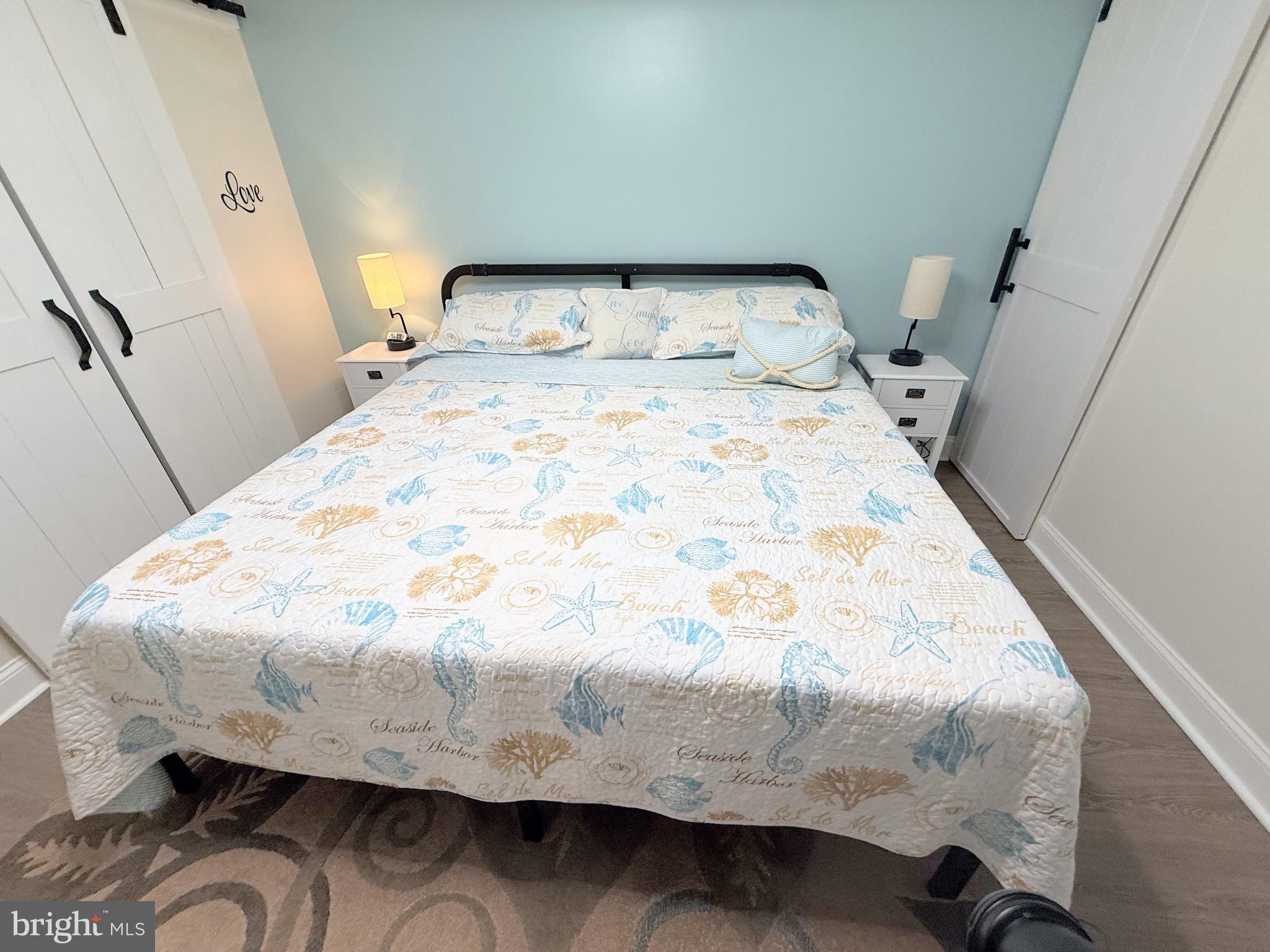 34479 Broad Water Road, Unit 644 Millsboro, DE 19966 - Photo 44 of 61 a bed sitting in a bedroom next to a window