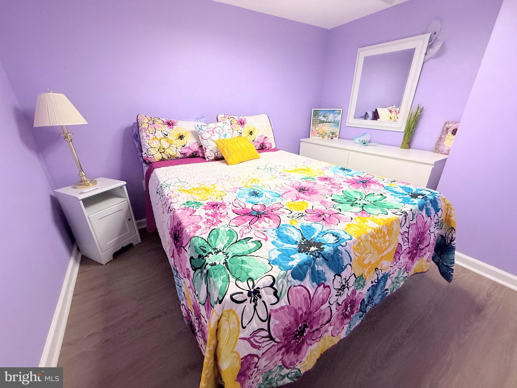 34479 Broad Water Road, Unit 644 Millsboro, DE 19966 - Photo 46 of 61 a bedroom with bed and a chair