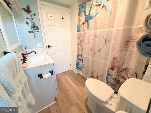 a view of a house with snow on the road