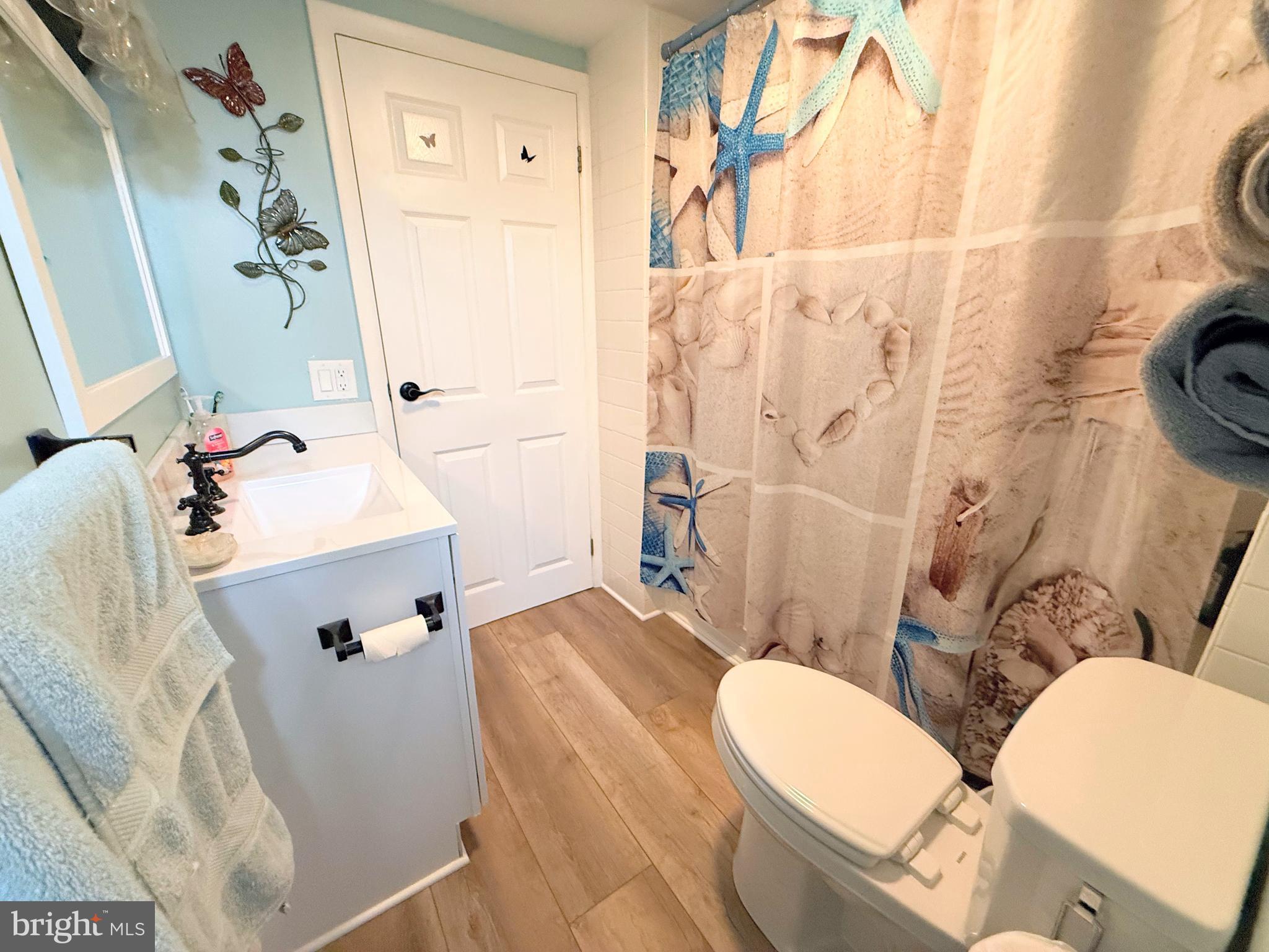 34479 Broad Water Road, Unit 644 Millsboro, DE 19966 - Photo 50 of 61 a bathroom with a sink toilet and shower