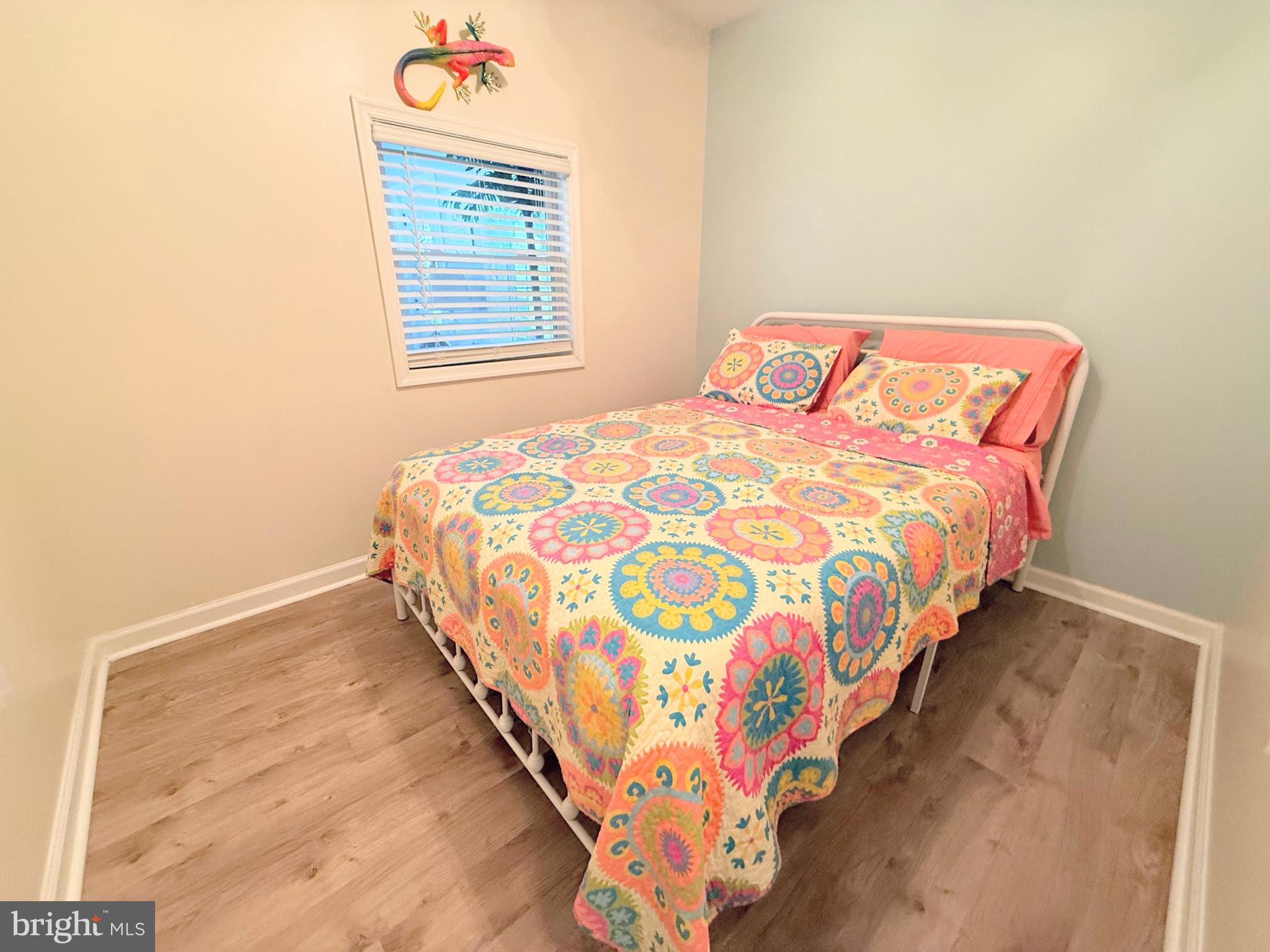 34479 Broad Water Road, Unit 644 Millsboro, DE 19966 - Photo 51 of 61 a bedroom with a bed and a window