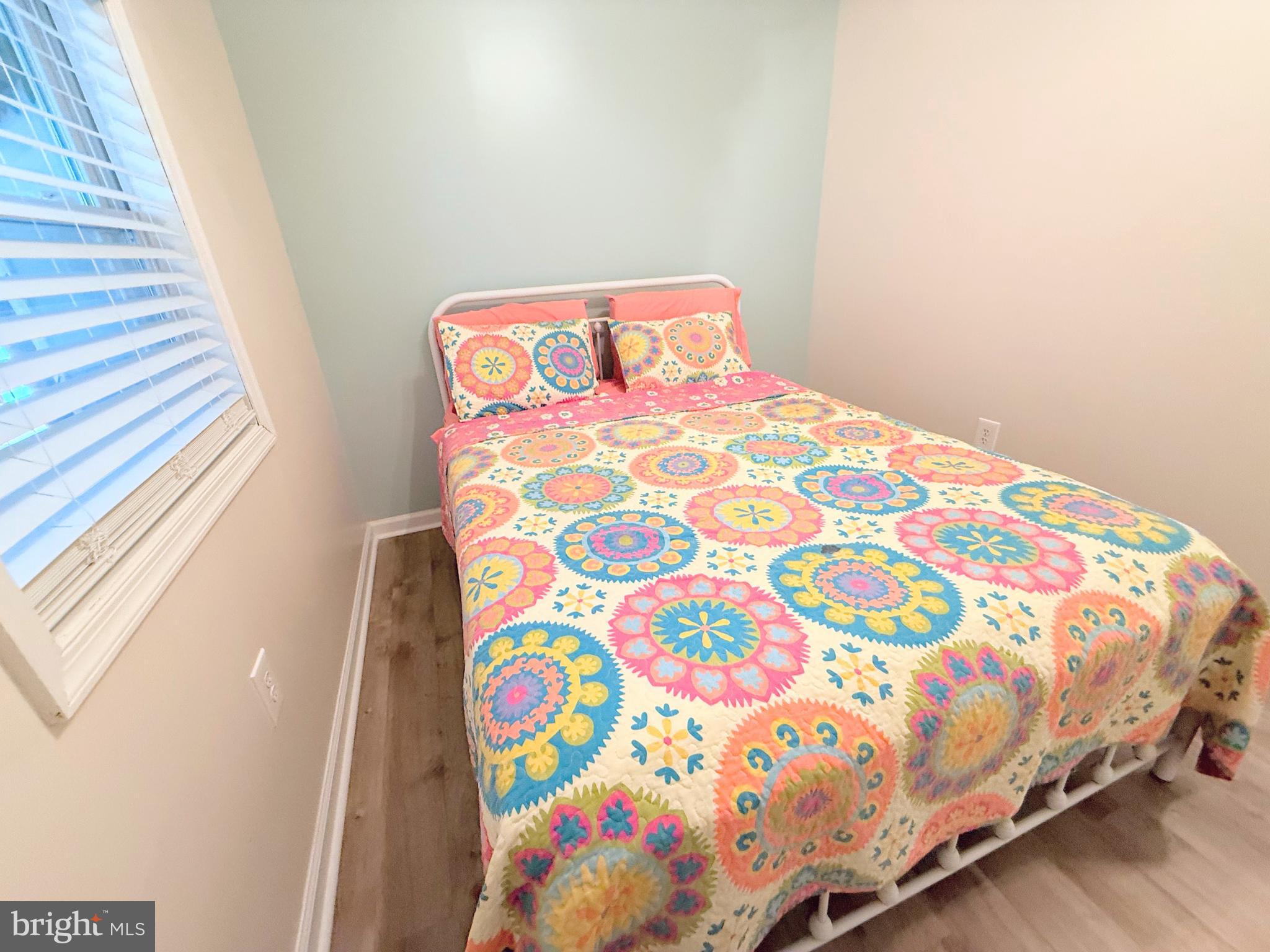 34479 Broad Water Road, Unit 644 Millsboro, DE 19966 - Photo 53 of 61 a bedroom with a bed and a window