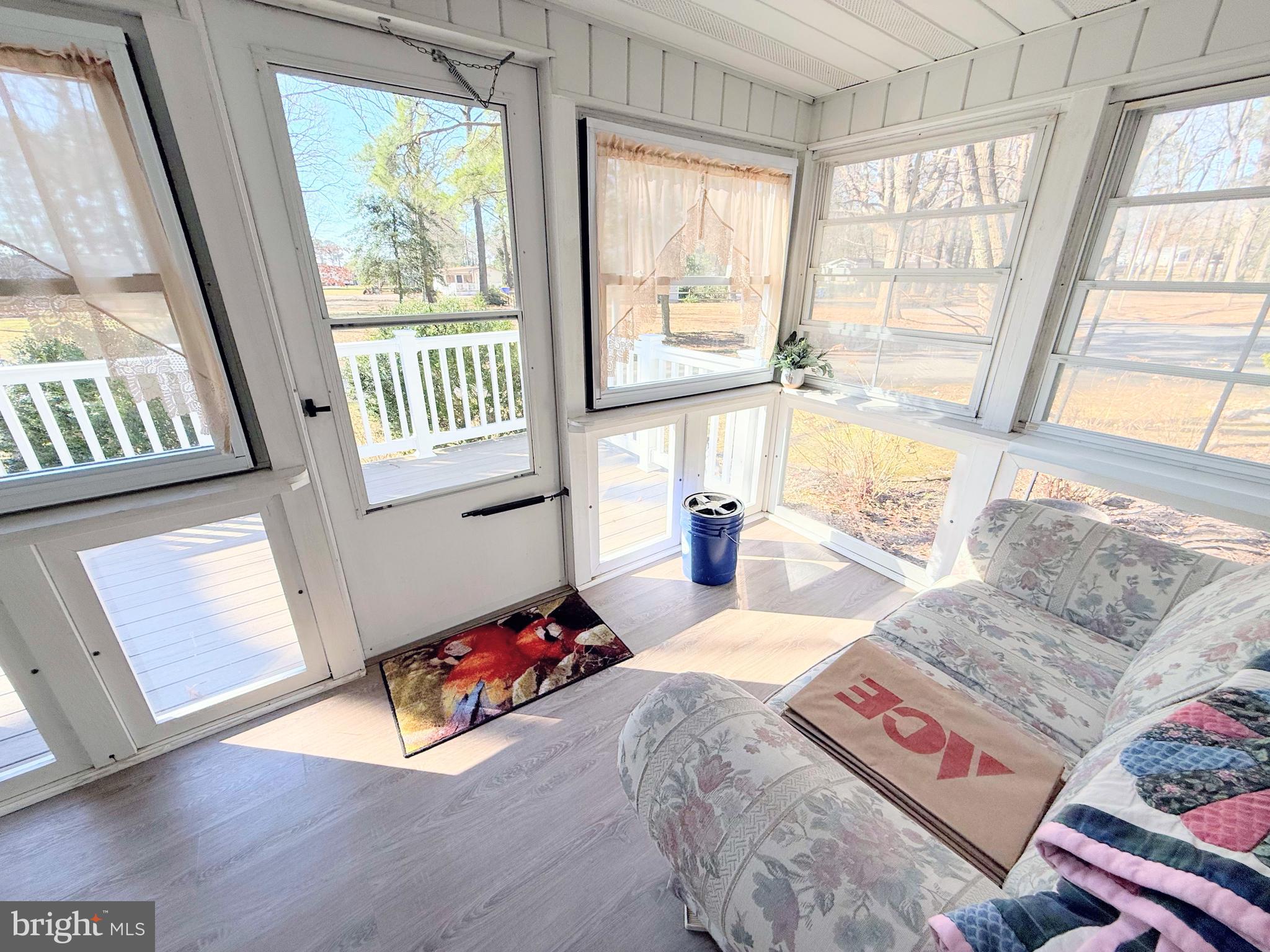34479 Broad Water Road, Unit 644 Millsboro, DE 19966 - Photo 7 of 61 a living room with furniture and a large window