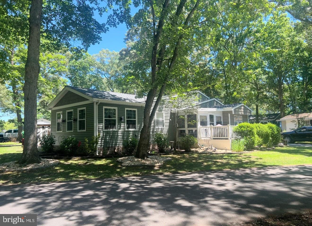 34479 Broad Water Road, Unit 644 Millsboro, DE 19966 - Photo 9 of 61 a front view of a house with a yard