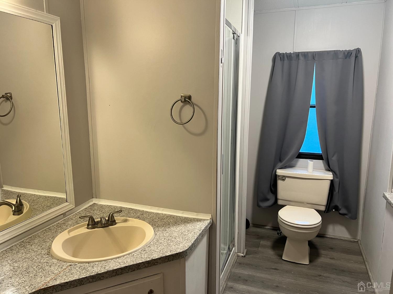 33 Poe Road North Brunswick, NJ 08902 - Photo 11 of 13 a bathroom with a granite countertop sink toilet and shower