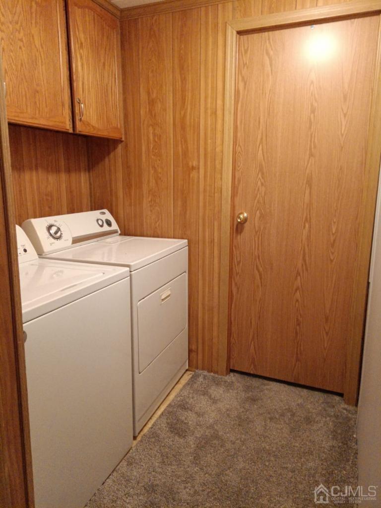 33 Poe Road North Brunswick, NJ 08902 - Photo 8 of 13 a view of storage and utility room with washer and dryer