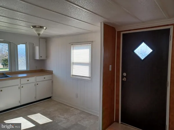 a spacious bathroom with a double vanity sink and a mirror