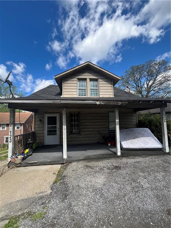 a view of a house with a balcony and garage