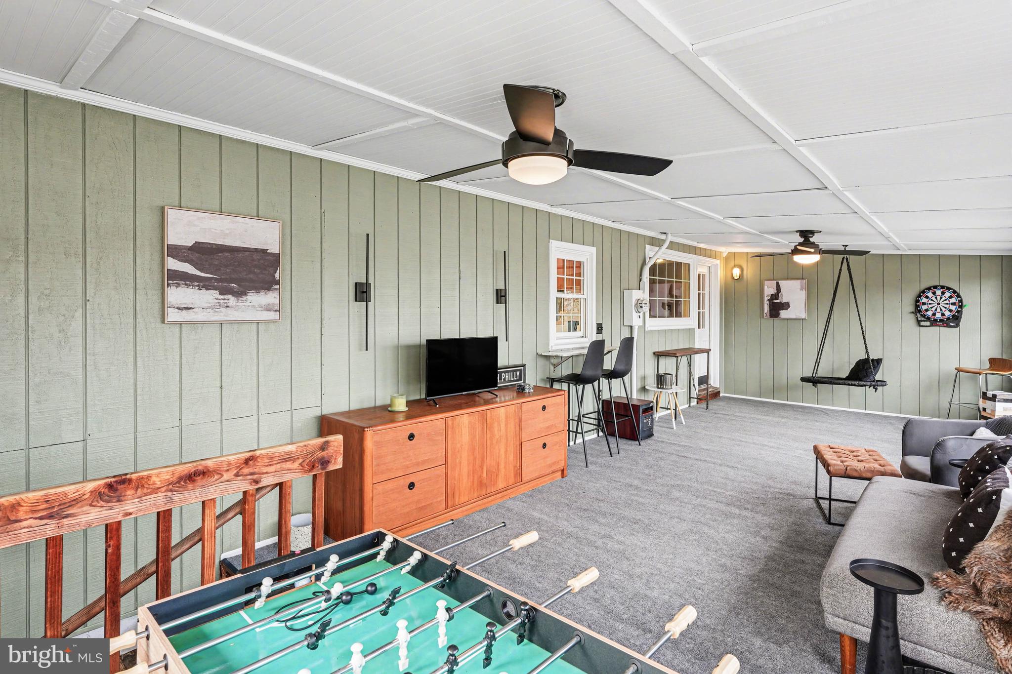 1408 Evans Road Ambler, PA 19002 - Photo 23 of 61 a large living room with furniture and a flat screen tv
