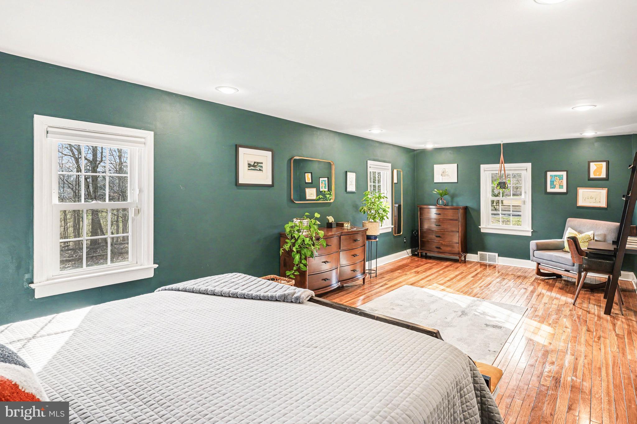 1408 Evans Road Ambler, PA 19002 - Photo 34 of 61 a bedroom with a bed and wooden floor