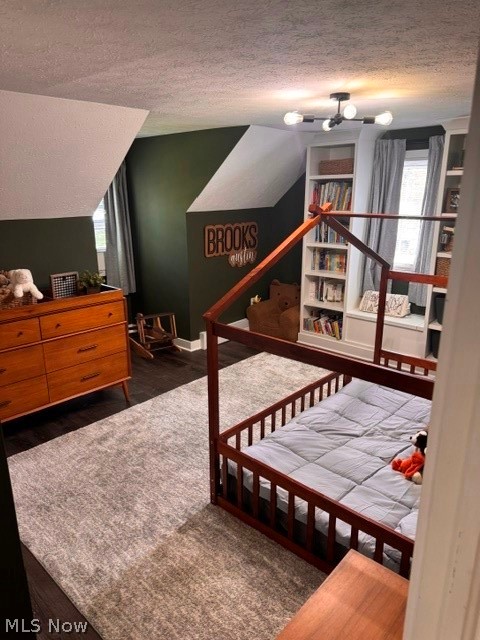 2760 Haines Road Madison, OH 44057 - Photo 24 of 33 Spacious room featuring dark wood-finish flooring, built-in shelving, and a modern ceiling light fixture