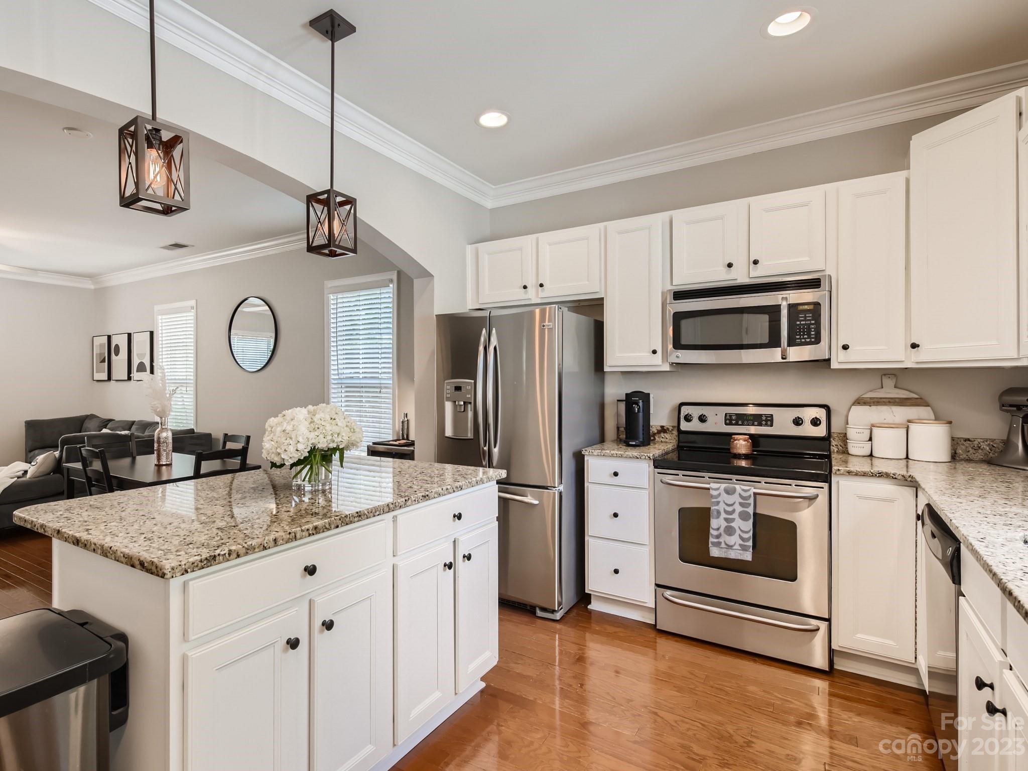 831 Millbrook Road Charlotte, NC 28211 - Photo 11 of 33 a kitchen with stainless steel appliances granite countertop a sink a stove and a refrigerator