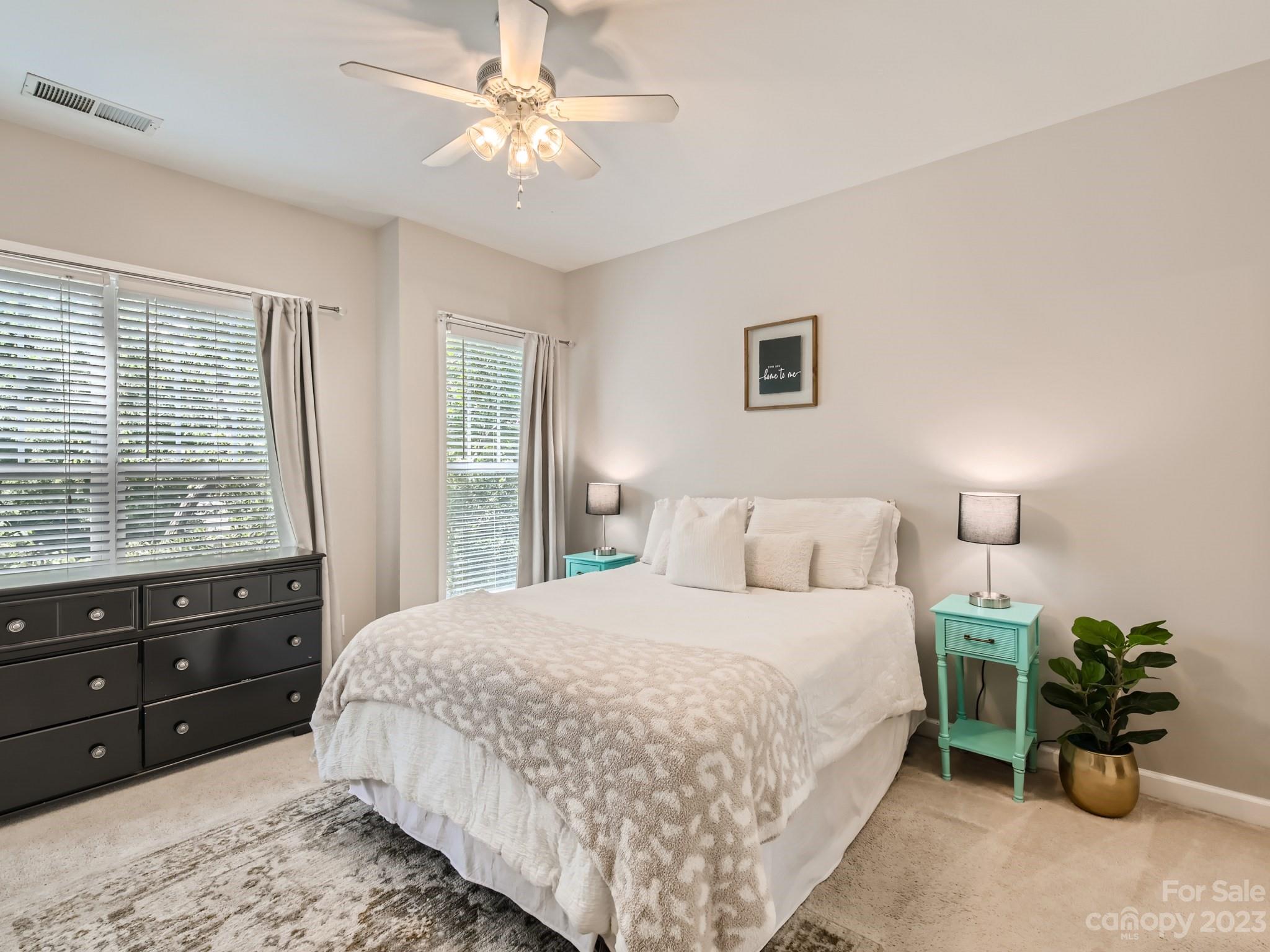 831 Millbrook Road Charlotte, NC 28211 - Photo 15 of 33 a bedroom with a bed dresser and a window