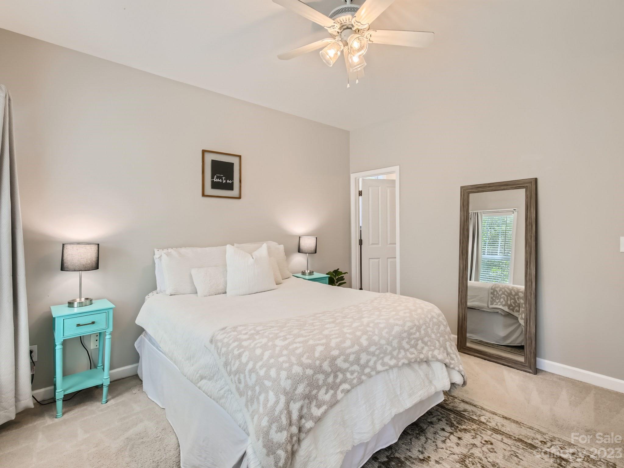 831 Millbrook Road Charlotte, NC 28211 - Photo 16 of 33 a bedroom with a bed and a mirror