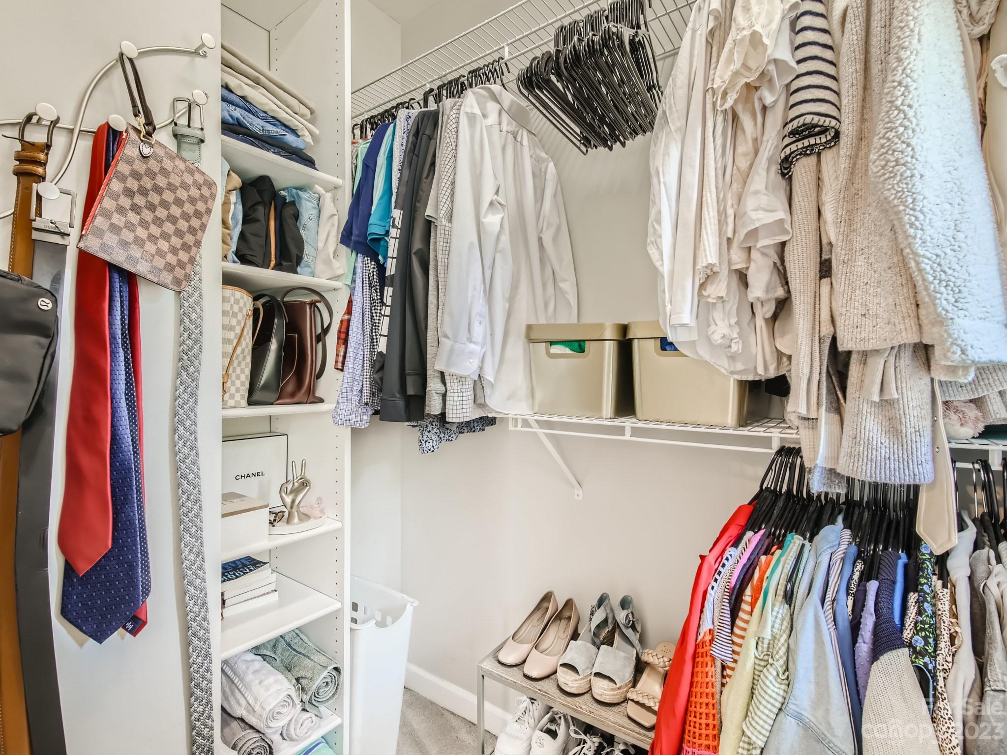 831 Millbrook Road Charlotte, NC 28211 - Photo 20 of 33 a view of walk in closet with clothes and shoes