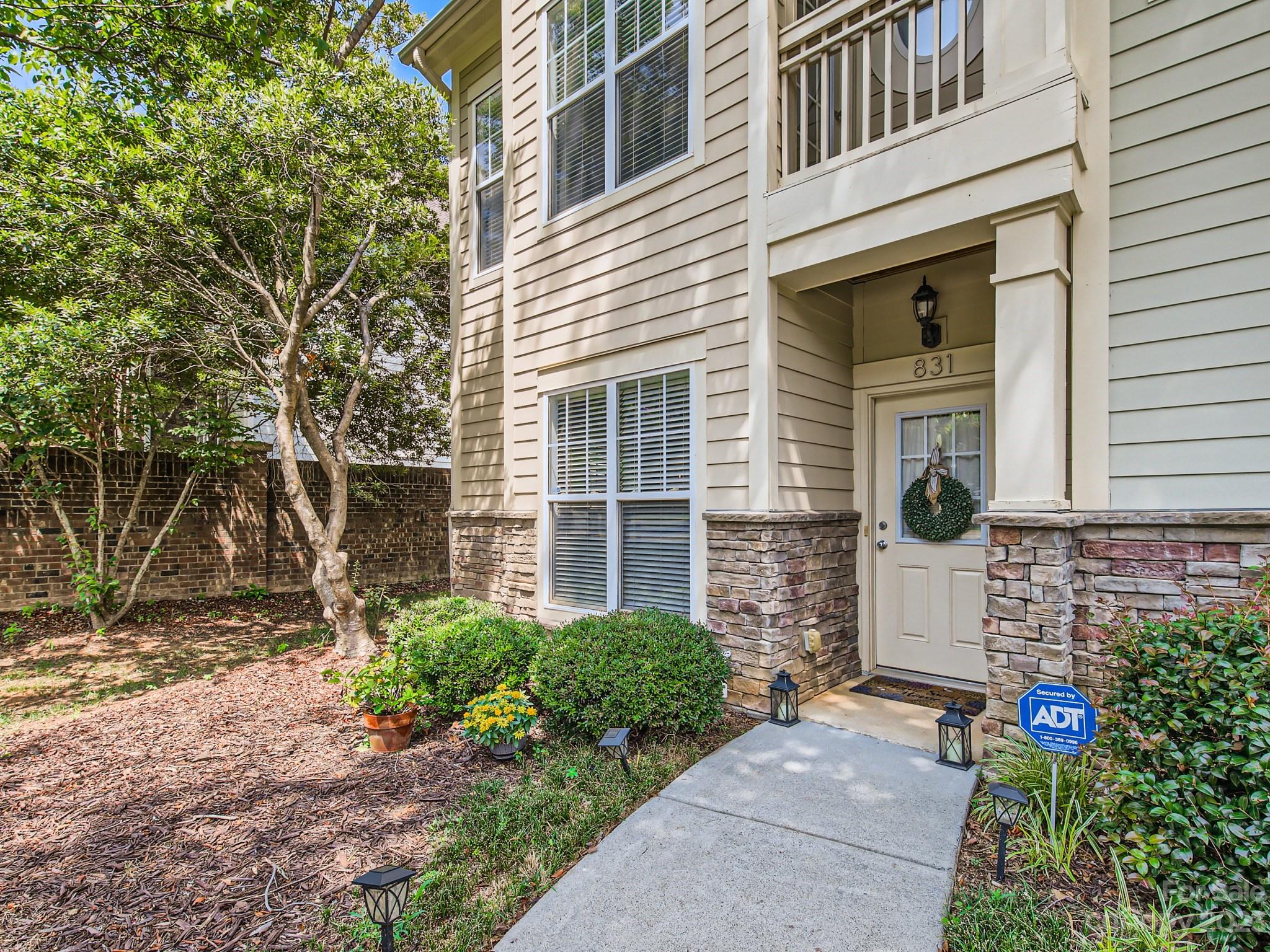 831 Millbrook Road Charlotte, NC 28211 - Photo 3 of 33 a front view of a house with a yard