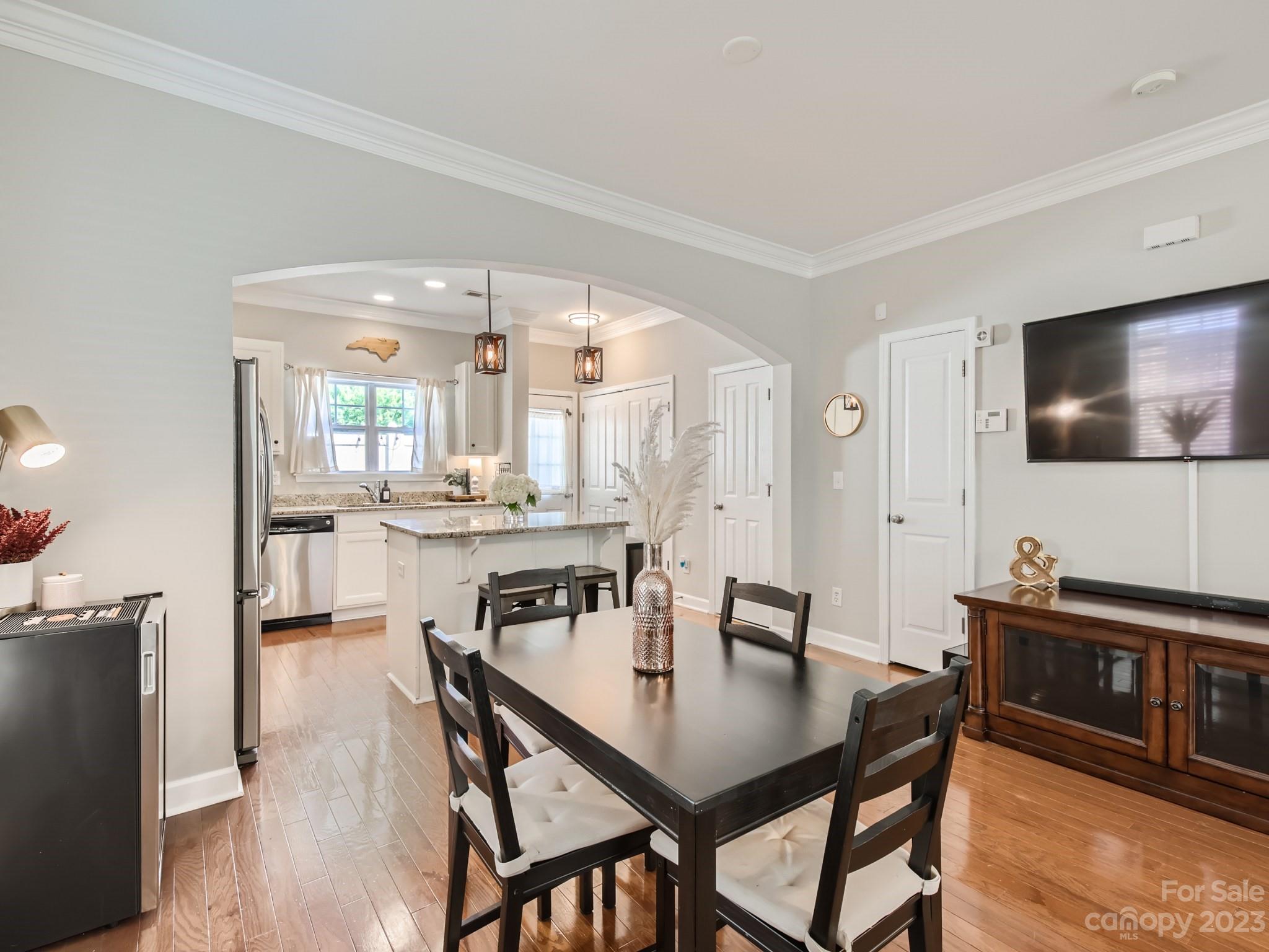 831 Millbrook Road Charlotte, NC 28211 - Photo 5 of 33 a view of a dining room with furniture and wooden floor