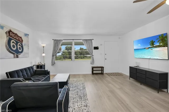 a living room with furniture and window