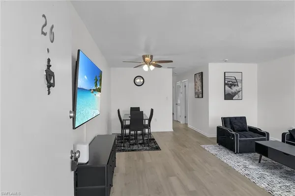 a view of a livingroom with furniture and wooden floor
