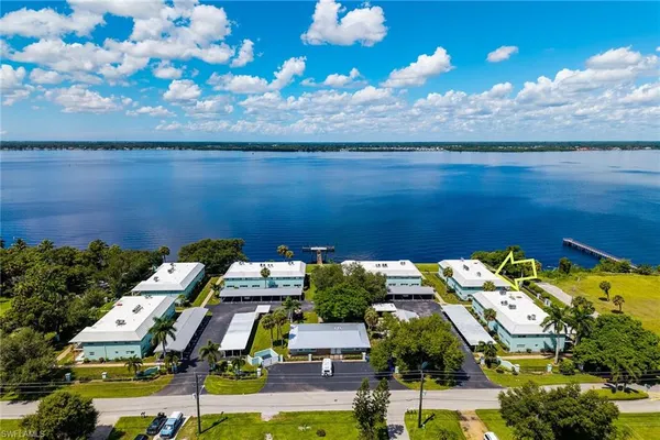 an aerial view of a house with a ocean view