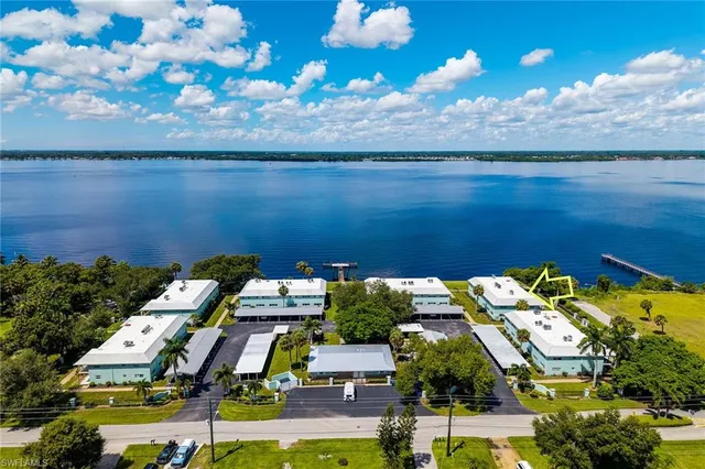 an aerial view of a house with a ocean view