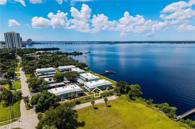 an aerial view of a house with a lake view