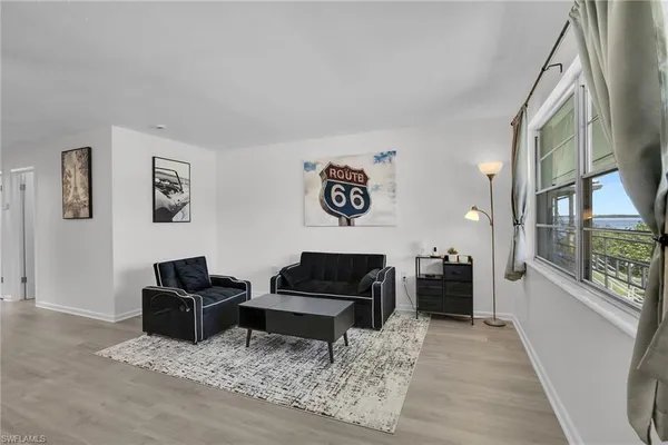 a living room with furniture and a rug