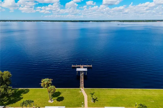 a aerial view of a house with a yard