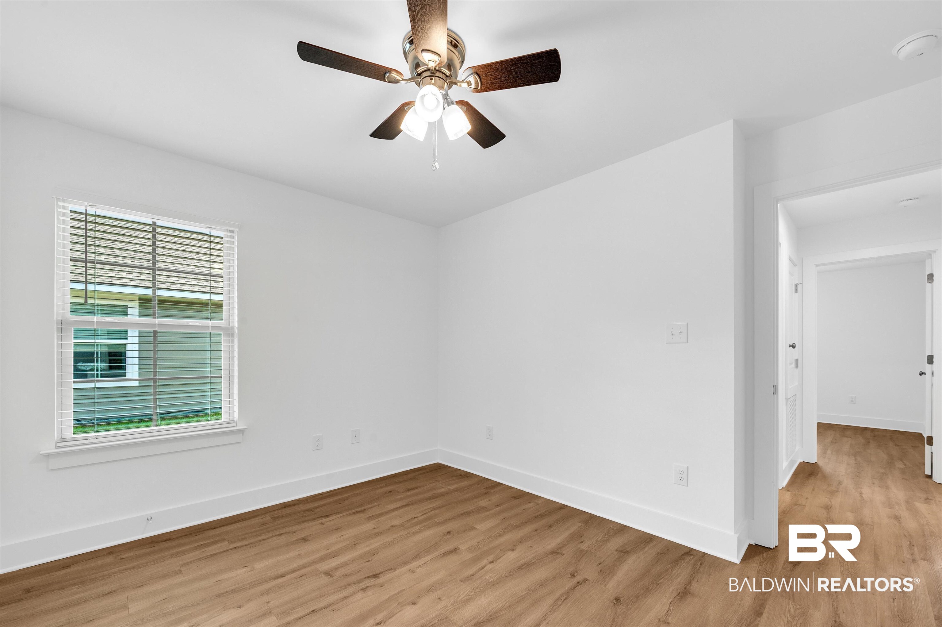 22045 8th Street Silverhill, AL 36576 - Photo 31 of 39 Bedroom featuring light wood finished floors, baseboards, and ceiling fan
