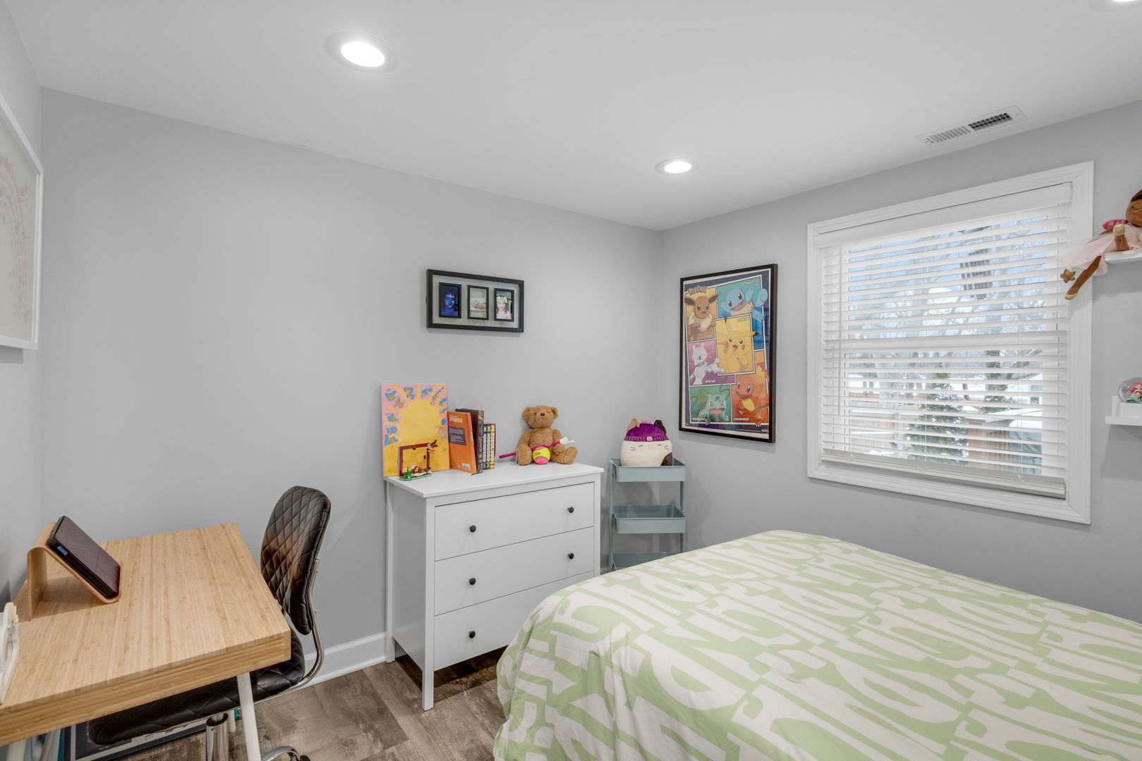 16446 West 147th Place Lockport, IL 60441 - Photo 11 of 22 a bedroom with a bed a desk and chair next to a window