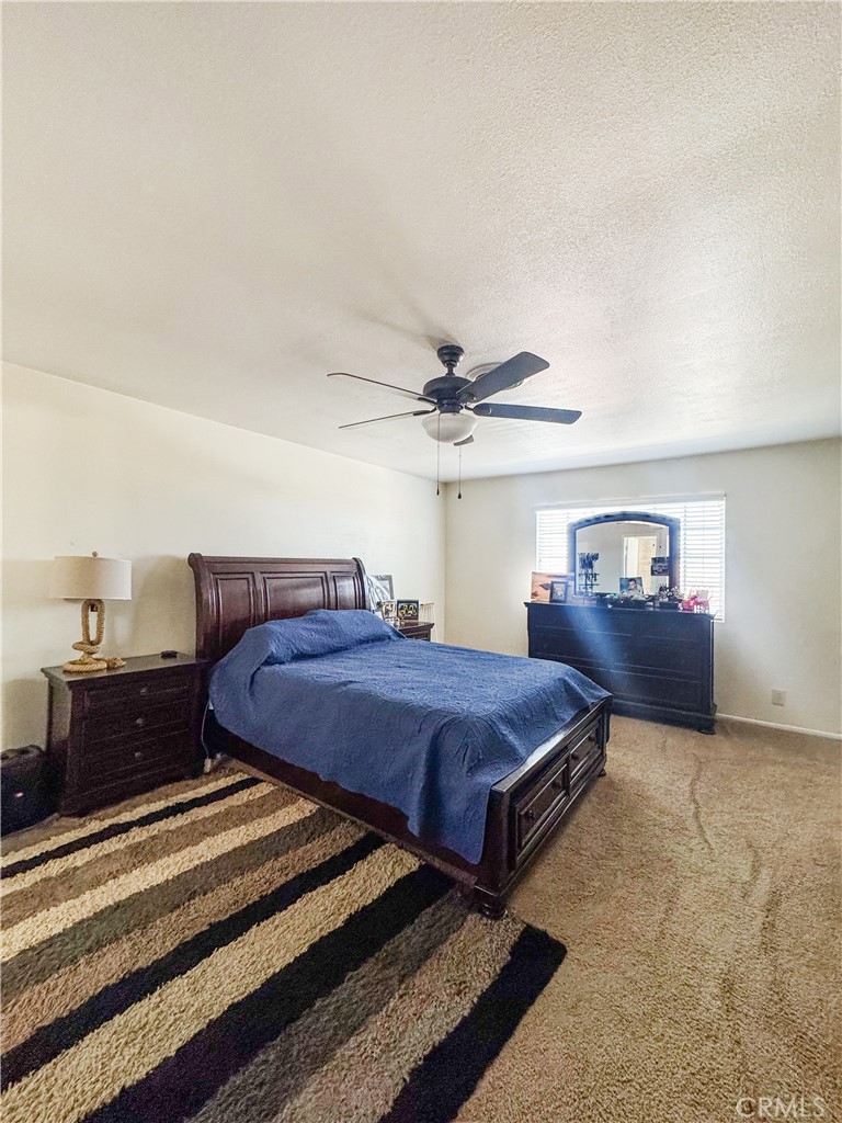 741 Ocotillo Road Blythe, CA 92225 - Photo 13 of 19 a spacious bedroom with a bed and cabinet