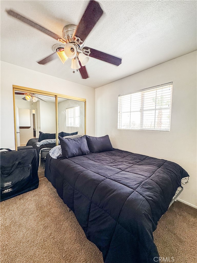 741 Ocotillo Road Blythe, CA 92225 - Photo 16 of 19 a bed room with a bed and a couch