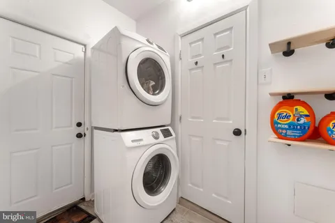 a view of a hallway with washer and dryer