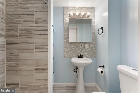a bathroom with a sink and mirror