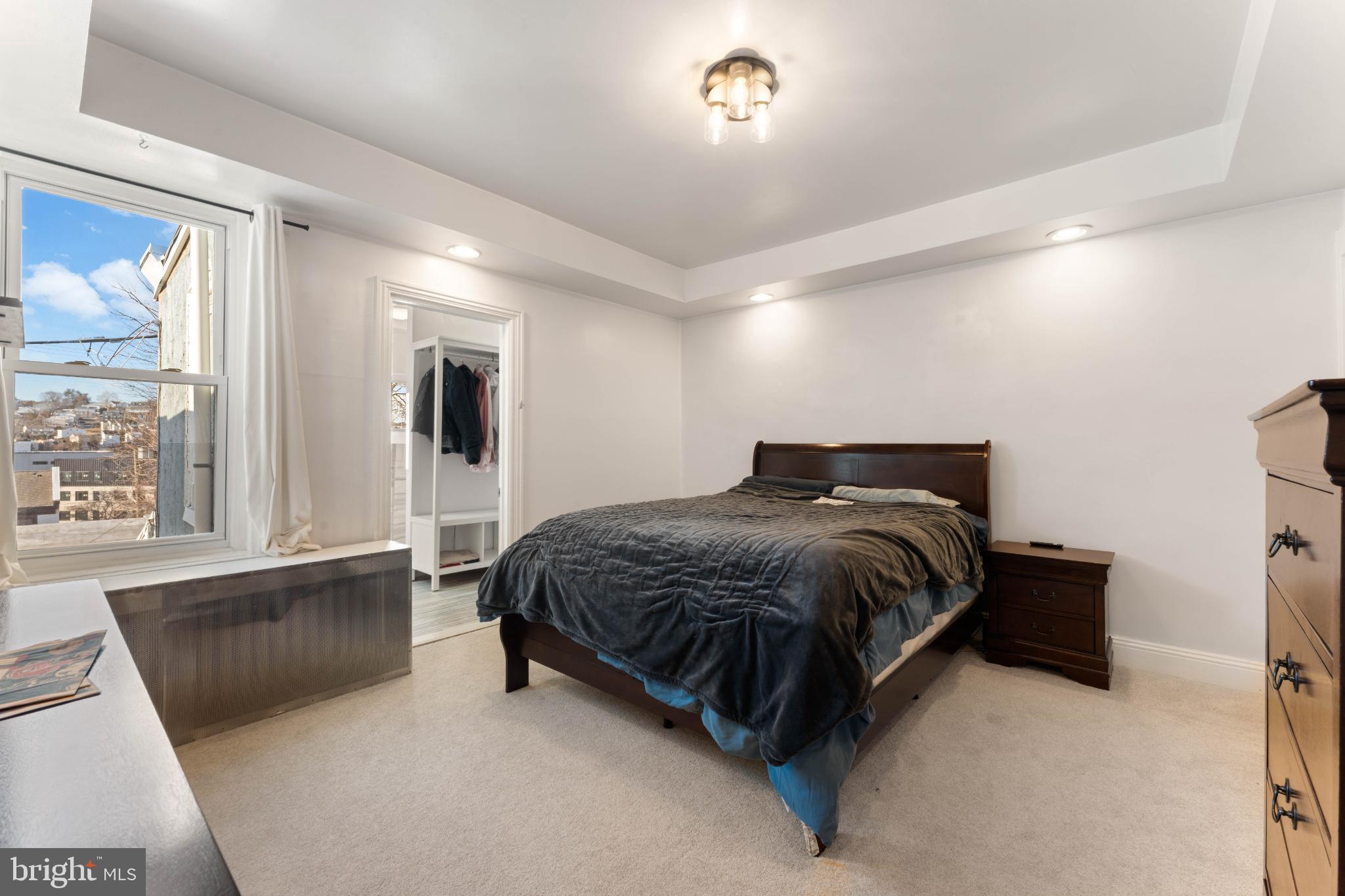 4618 Smick Street Philadelphia, PA 19127 - Photo 19 of 32 a spacious bedroom with a bed and large window