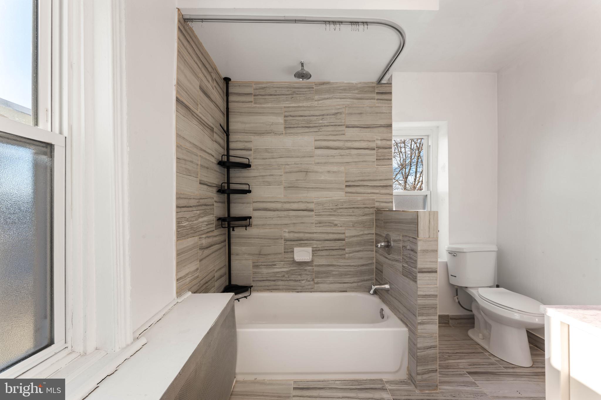 4618 Smick Street Philadelphia, PA 19127 - Photo 22 of 32 a bathroom with a shower and a toilet