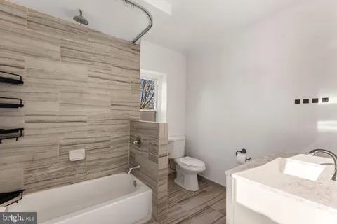 a bathroom with a sink and a bathtub