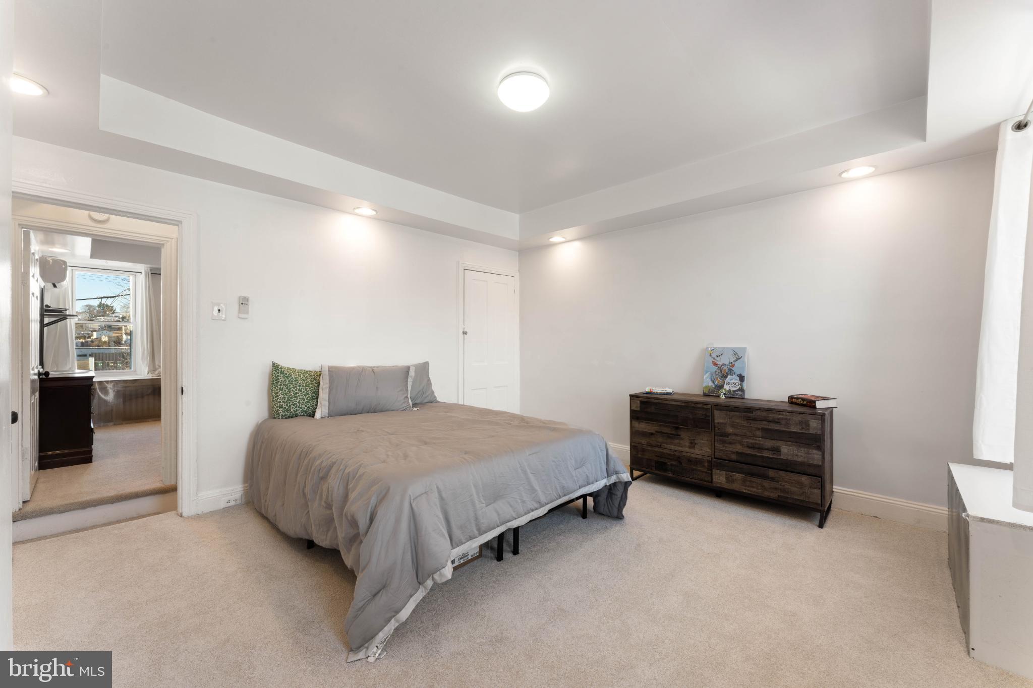 4618 Smick Street Philadelphia, PA 19127 - Photo 26 of 32 a bedroom with a bed and dresser