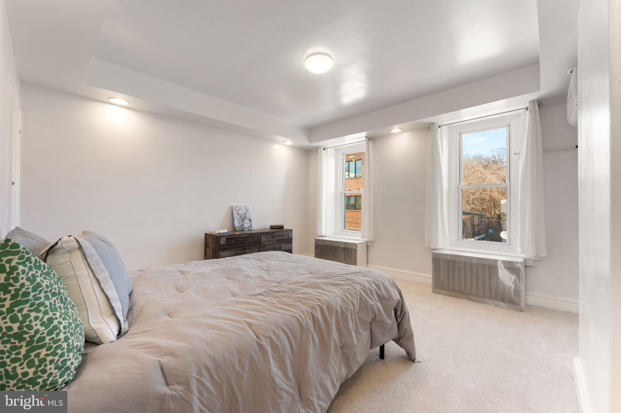 4618 Smick Street Philadelphia, PA 19127 - Photo 27 of 32 a bedroom with a large bed and a window